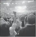  ?? CHASE STEVENS/ LAS VEGAS REVIEW-JOURNAL ?? Fans cheer at the start of the bout between Floyd Mayweather Jr. and Manny Pacquiao at the MGM Grand Garden on Saturday. MGM Resorts’ financial results from the fight won’t be realized until the second quarter.