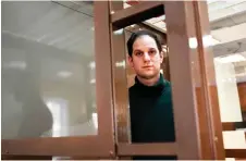  ?? — AFP photo ?? Gershkovic­h looks out from inside a defendants’ cage before a hearing to consider an appeal on his extended pre-trial detention, at the Moscow City Court in Moscow.