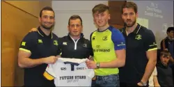  ??  ?? David Murdock, Dundalk Grammar School, receives his Future Stars jersey from Dave Kearney, Bryan Byrne and Dominic Ryan.