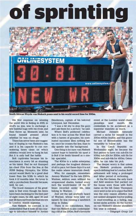 ?? AP ?? South African Wayde van Niekerk poses next to his world record time for 300m.