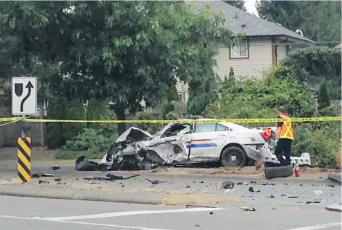  ?? RIC ERNST/PNG FILES ?? An RCMP cruiser was demolished, as was the van it collided with after a crash in 2014 in the Langley community of Aldergrove. Amazingly, the officer and a family of four in the van all walked away from the crash.
