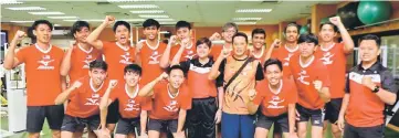  ??  ?? The men’s volleyball team with chef de mission Datuk Marina Chin.