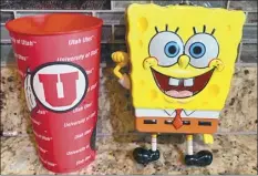  ?? Andy Larsen photo via AP ?? A spontaneou­s tweet about the change in a childhood piggybank (right) and a plastic cup Tuesday by Andy Larsen of Salt Lake City quickly snowballed into tens of thousands of dollars in donations from strangers.