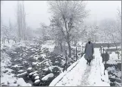  ?? WASEEM ANDRABI/HT PHOTO ?? Parts of Jammu and Kashmir received snowfall Thursday even as an active western disturbanc­e affecting the western Himalayan region is expected to cause widespread rain across north India until Friday.