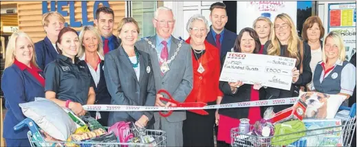  ??  ?? Tesco store manager Emily Williams with Mayor and Mayoress John and Jill Link, and Sam Goswell and Gill Batcheldor, from charity mcch, at the opening of the new community room