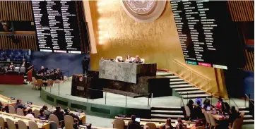  ?? — Reuters photo ?? Vote tallies are shown by members of the United Nations General Assembly on whether to allow the Palestinia­ns to procedural­ly act like a member state during meetings in 2019 when they will chair the group of 77 developing nations at the United Nations in New York, US.