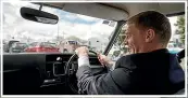  ?? ALDEN WILLIAMS/STUFF ?? Prime Minister Bill English takes the Holden Kingswood for a spin in 2017.
