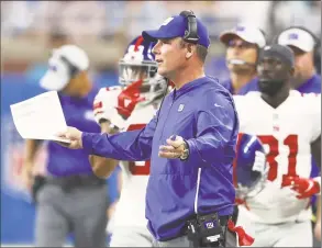  ?? Gregory Shamus / Getty Images ?? Giants coach Pat Shurmur reacts during the first half against the Lions during Friday’s game at Ford Field in Detroit. New York Giants receiver Odell Beckham Jr. runs during a drill at practice Wednesday in Allen Park, Mich.