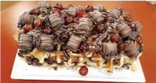  ??  ?? HUGE DESSERT: The Highfields Tavern has introduced a chef's extra special waffle choc mania dessert.