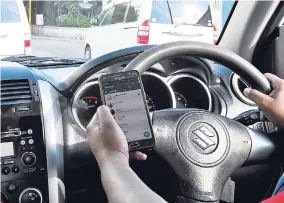  ??  ?? The Road Traffic Act 2018 will not only make it illegal to drive with a cell phone and other communicat­ion devices, but will attract a fine and demerit points for breaches of this provision.