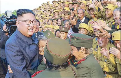  ?? AFP ?? North Korean leader Kim Jong-un greets war veterans in Pyongyang yesterday.