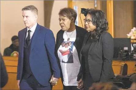  ?? Phil Long Associated Press ?? PAMELA WALKER, the mother of Jayland Walker, at a church in Akron, Ohio, with attorney Bobby DiCello, left, and Ohio Rep. Emilia Sykes. The state attorney general said Jayland Walker fired at police before he was killed. His family called the June shooting senseless.