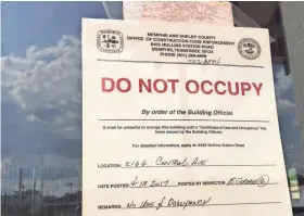  ?? TOM BAILEY/THE COMMERCIAL APPEAL ?? Building inspectors on Thursday posted “Do Not Occupy” notices on most of the Railgarten entertainm­ent complex.