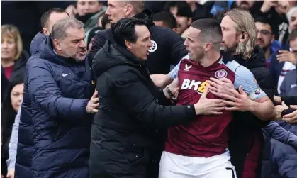  ?? ?? Unai Emery tries to calm down John McGinn after his red card. Photograph: David Klein/Reuters