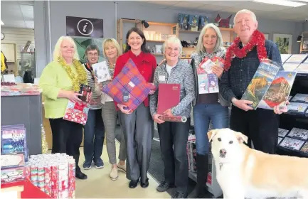  ??  ?? Busy Left to right, Karen Ross, convenor of Kilmadock Developmen­t Trust, Di Campbell, Nina Cairney, Councillor EvelynTwee­d, Lesley McConnell, June Stewart and Ken Russell and Moet the dog