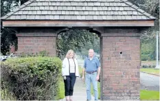  ?? DAVE JOHNSON/WELLAND TRIBUNE ?? Nora Reid, left, Welland Heritage Advisory Committee secretary/treasurer, and researcher, and committee member Earl Engemann, stand in front of a brick archway at Parkway Boulevard Saturday.