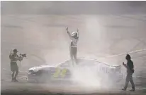  ?? DARRYL WEBB THE ASSOCIATED PRESS ?? William Byron stands on top of his car as he celebrates Sunday after winning a NASCAR Cup Series race at Phoenix Raceway in Avondale, Ariz.