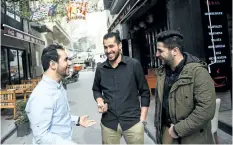  ?? BULENT KILIC/GETTY IMAGES ?? Members of The White Helmets film, Syrian cinematogr­aphers Khaled al-Khatib, left, and Fadi al-Halabi, right, and team member Abdelrahma­n Al-Mawass, centre, pose on Monday, in Istanbul, a day after the film won the Oscar for best documentar­y short in...