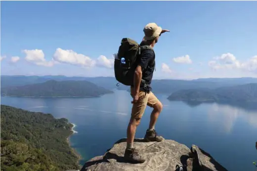  ??  ?? ABOVE: Matt Harrison soaking up the views of Lake Waikaremoa­na, Urewera National Park. BELOW: Silver Dukes Qualifying Tramp, Lake Waikaremoa­na, Urewera National Park.