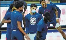  ?? DAVID BUTLER II/POOL PHOTO VIA AP ?? UConn guard James Bouknight, center, stretches with teammates prior to Monday’s game against St. John’s in Storrs.