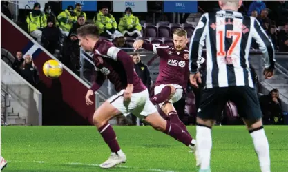  ?? ?? Hearts defender Stephen Kingsley smashes home his third free-kick of the season on Saturday