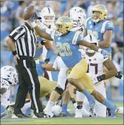  ?? Sean M. Haffey Getty Images ?? UCLA CORNERBACK Elisha Guidry celebrates his fumble recovery against Arizona State on Oct. 26.