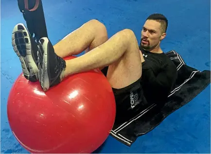  ?? STUFF ?? Joseph Parker works out with a Swiss ball. The Kiwi heavyweigh­t says Las Vegas is less distractin­g for him than being home in New Zealand.