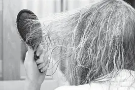  ?? DREAMSTIME ?? Many of us have hair that becomes like a wild animal when touched by water.