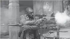  ?? SONY PICTURES ?? Have guns, will travel for Roland Deschain (Idris Elba) in The Dark Tower. Too bad the movie went nowhere.