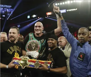  ?? ISAAC BREKKEN — THE ASSOCIATED PRESS ?? Tyson Fury celebrates after defeating Deontay Wilder in their WBC heavyweigh­t championsh­ip match Saturday night in Las Vegas.