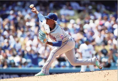  ?? Ronald Martinez / Getty Images ?? The Mets’ Marcus Stroman throws against the Dodgers in the fifth inning Sunday in Los Angeles.