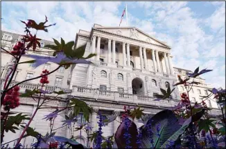  ?? ?? The Bank of England stands in the financial district of The City of London, Wednesday, Oct. 12, 2022. The pound sank against the dollar early Wednesday after the Bank of England governor confirmed the bank won’t extend an
emergency debt-buying plan introduced last month to stabilize financial markets. (AP)