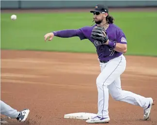  ?? Matt York, The Associated Press ?? Rockies second baseman Brendan Rodgers has a strained hamstring that could keep him from starting on opening day.