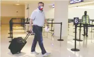  ?? STRINGER / REUTERS ?? Senator Ted Cruz of Texas, seen at Cancun airport before returning to the U.S., is under fire for his trip to Mexico.