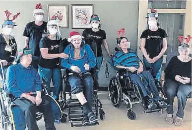  ?? FAIRHAVEN ?? Fairhaven long-term-care home staff and residents celebrate Christmas in the summer. Shown in their special hats are back row, from left, Chris Bolton, Dave Finn, Janet Topper, Jasmine McCracken and Kim Pottle, and front from left, Les Metcalf, Ted Briggs, Terry Hunter and Helen Cassidy.