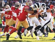  ?? WALLY SKALIJ/TRIBUNE NEWS SERVICE ?? Rams quarterbac­k Jared Goff is sacked by 49ers defensive lineman Solomon Thomas at the Coliseum on Sunday.