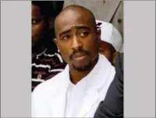  ?? FRANK WIESE — THE ASSOCIATED PRESS FILE ?? In this file photo, rapper Tupac Shakur attends a voter registrati­on event in South Central Los Angeles. Shakur and Seattle-based rockers Pearl Jam are among the first-time nominees on the ballot for induction next year into the Rock and Roll Hall of...