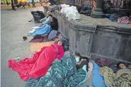  ?? AP PHOTO/DARIO LOPEZ-MILLS ?? Migrants sleep under a gazebo at a park in the Mexican border city of Reynosa on Saturday.