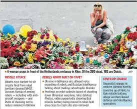  ?? AFP ?? A woman prays in front of the Netherland­s embassy in Kiev. Of the 295 dead, 192 are Dutch.