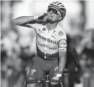  ?? Stephane Mahe, AFP via Getty ?? France’s Julian Alaphilipp­e celebrates his win the 2nd stage of the Tour de France Sunday.