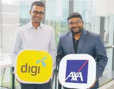  ??  ?? Praveen (le ) and Rohit pose for a photo a er announcing AXA AFFIN Life Insurance’s move to appoint Omni as its preferred virtual office provider.