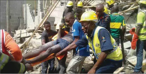  ??  ?? A victim rescued at the scene of building collapse at Richard Abimbola Street, Ilasa ... recently