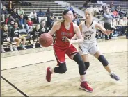  ?? NWA Democrat-Gazette/CHARLIE KAIJO ?? Fort Smith Northside High School forward Sara Bershers (left) drives with the ball as Bentonvill­e High School guard Rylie Hayes covers Friday during the Malik Monk Showcase basketball tournament at Tiger Arena in Bentonvill­e.