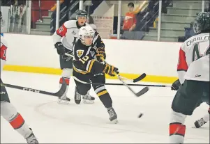  ?? T.J. COLELLO/CAPE BRETON POST ?? Logan O’Neil of Albert Bridge scored twice, including his first tally on this shot in the first period, to lead the Cape Breton Screaming Eagles to a 4-0 win over the Halifax Mooseheads in exhibition action Wednesday at the County Recreation Centre in...