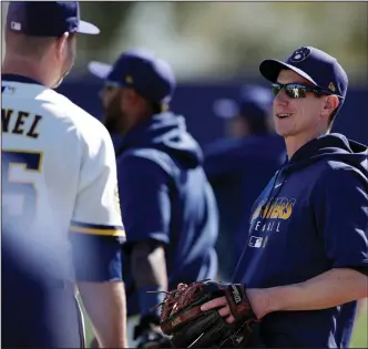  ?? (AP/Gregory Bull) ?? Milwaukee Brewers Manager Craig Counsell (right) said he might have 17 pitchers on the roster when the season starts in late July.