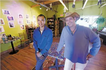  ?? PHOTOS BY LUIS SÁNCHEZ SATURNO/THE NEW MEXICAN ?? From left, David Michael Tardy and Robert McCormick, co-owners of Cuba Fe, stand Monday in the restaurant at Cerrillos Road and Third Street. Flan, right, a dessert served at Cuba Fe.