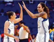  ?? Matt York/Associated Press 2014 ?? Phoenix Mercury and U.S. teammates Diana Taurasi (left) and Brittney Griner have been in touch.