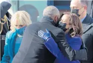  ?? WIN MCNAMEE/GETTY-AFP ?? Vice President Kamala Harris hugs former President Barack Obama after the inaugurati­on.