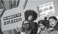  ?? DREW ANGERER/GETTY IMAGES ?? Activists and community members rallied to oppose Amazon's plan to move into the Long Island City neighborho­od of Queens.