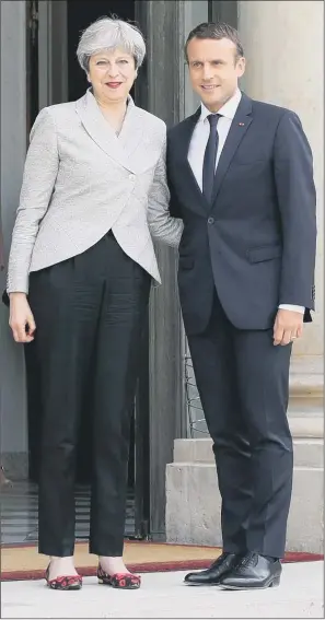  ?? PICTURE: YUI MOK/PA. ?? COMMON GROUND: Prime Minister Theresa May with French President Emmanuel Macron, who said he wanted Brexit negotiatio­ns to start ‘as quickly as possible’ when the leaders met yesterday.